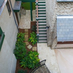 Barrier island home birdseye view of backyard patio staircases